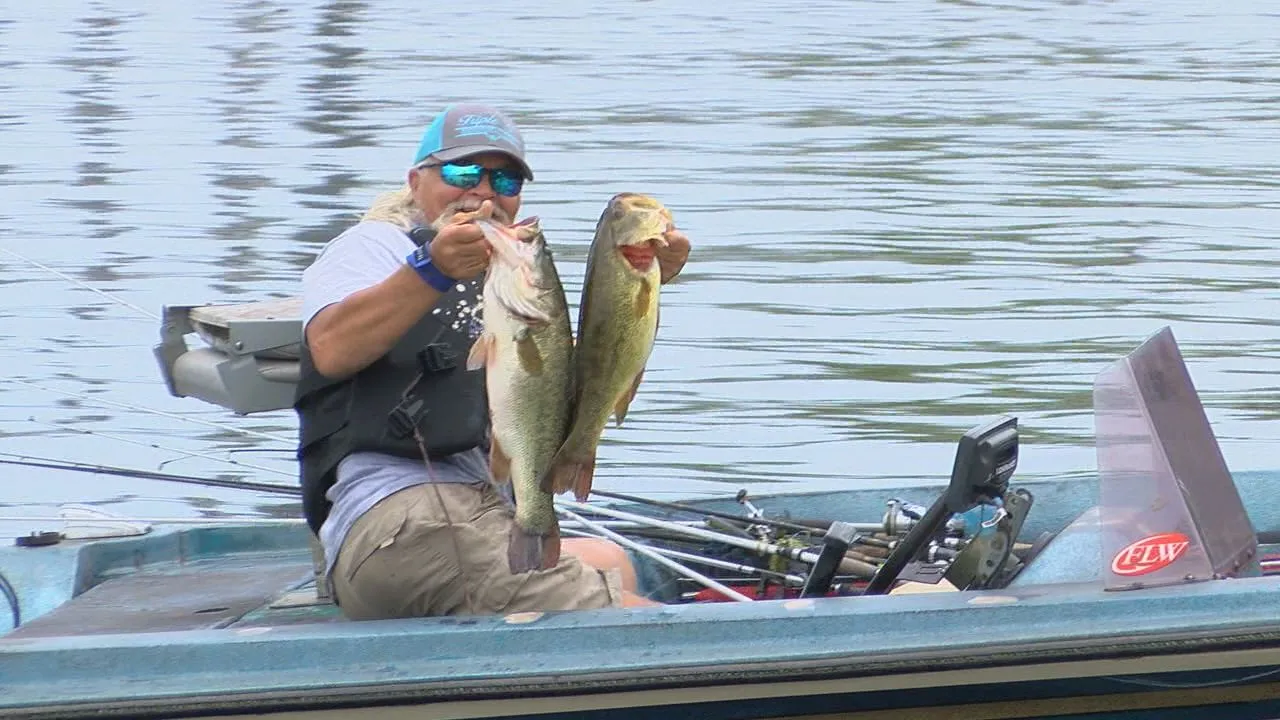 An angler with a healthy 5-pound largemouth, showcasing the typical high-quality fish found at Sam Rayburn.